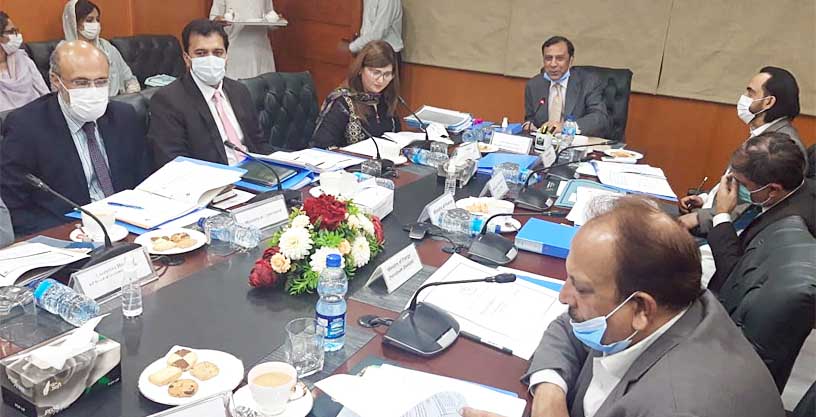Atif Bokhari chairing approval committee meeting